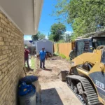 Curved concrete walkway connecting patio to yard in Colorado