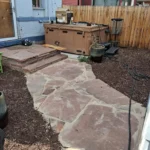 Flagstone patio with hot tub pad installed in Denver, Colorado